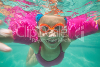 Cute kid posing underwater in pool