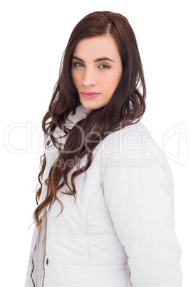 Beauty brown hair in white coat posing