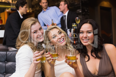 Pretty friends having a drink together