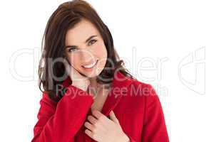 Portrait of a happy brunette in red coat