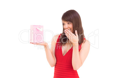 Festive brunette holding a gift bag