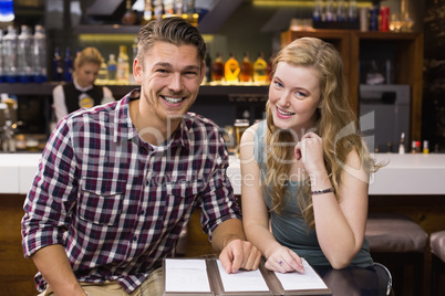 Young couple discussing the menu