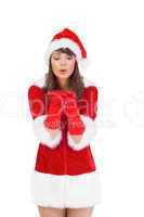Sexy santa girl blowing over hands
