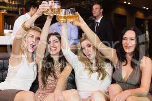 Pretty friends having a drink together