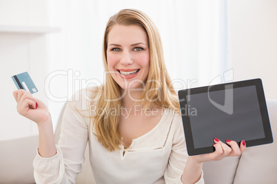 Pretty blonde shopping online with tablet