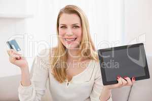 Pretty blonde shopping online with tablet