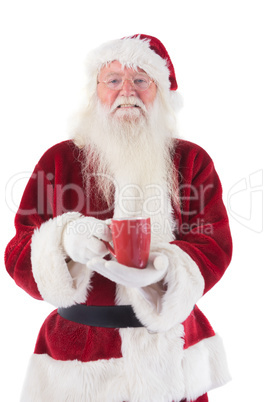 Santa holds a red cup