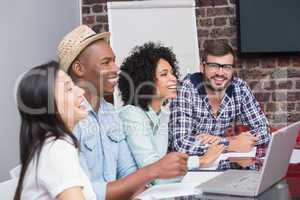 Cheerful creative business team in meeting