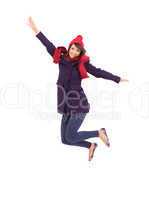 Woman in warm clothing jumping
