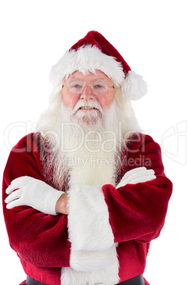 Santa smiles with folded arms