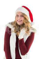 Blonde in santa hat smiling at camera