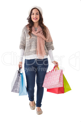 Beautiful brunette holding shopping bags