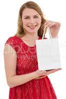 Pretty blonde in red dress holding a shopping bag