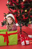 Festive little girl sitting in large gift