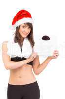 Festive fit brunette holding weighing scales