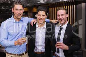 Handsome friends having a drink together