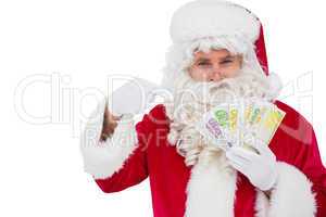 Santa claus pointing his cash