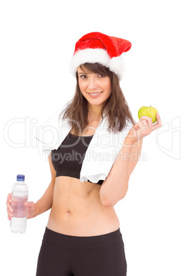 Festive fit brunette smiling at camera