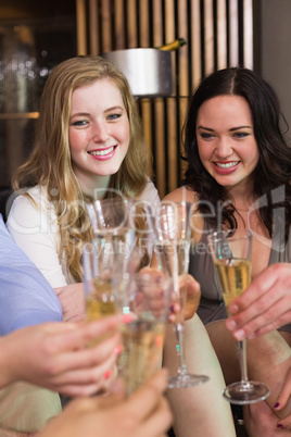 Stylish friends having a drink together