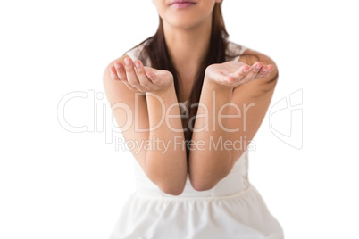 Mid section of woman with hands out