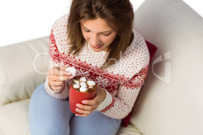 Brunette in winter fashion holding mug