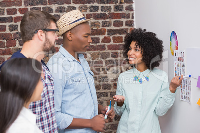 Team looking at sticky notes on wall