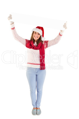 Festive woman holding up empty banner