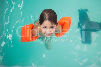 Little boy smiling in the pool