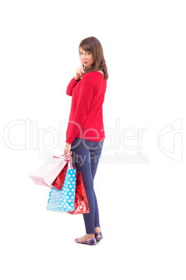 Festive brunette holding gift bags