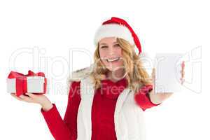 Festive blonde holding gift on right hand