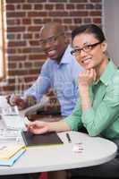 Smiling photo editors in office