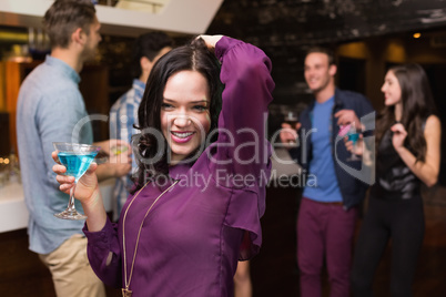 Pretty brunette drinking a cocktail Pretty brunette drinking a cocktail