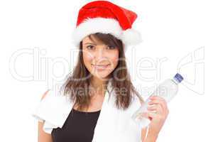 Festive fit brunette smiling at camera