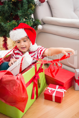 Cute boy in large christmas present