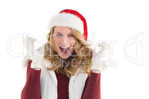 Blonde woman in santa hat screaming at camera