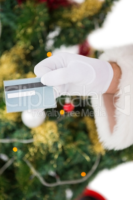 Hand of santa holding credit card