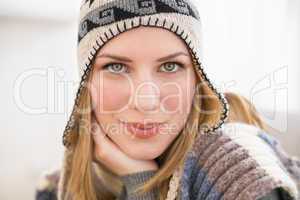 Close up of a woman in winter hat looking at the camera