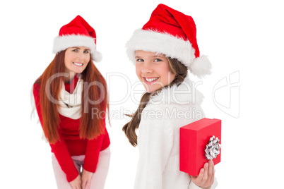 Mother and daughter with christmas gift