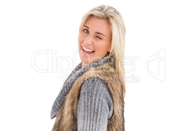 Blonde in winter clothes smiling