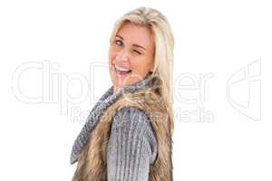 Blonde in winter clothes smiling