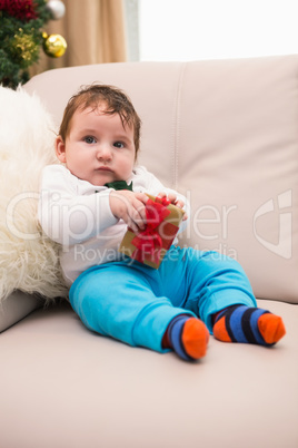 Cute baby boy on the couch at christmas