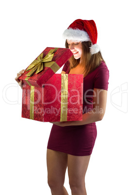 Smiling woman opening christmas present