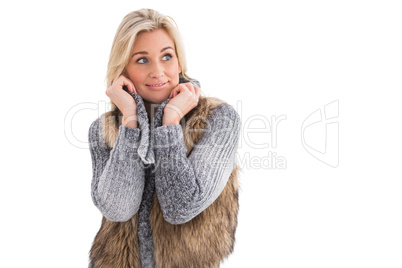 Blonde in winter clothes smiling