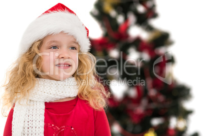 Festive little girl in santa hat and scarf