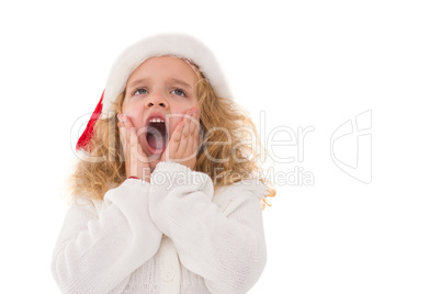 Festive little girl with hands on face