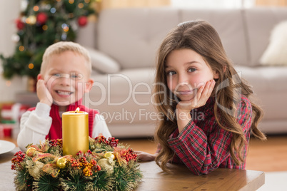 Festive siblings smiling at camera