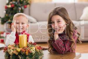 Festive siblings smiling at camera