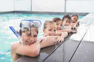 Cute swimming class in the pool