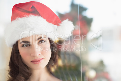 Portrait of a festive brunette thinking