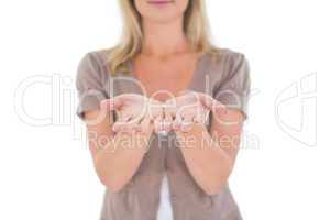 Happy blonde holding our her hands